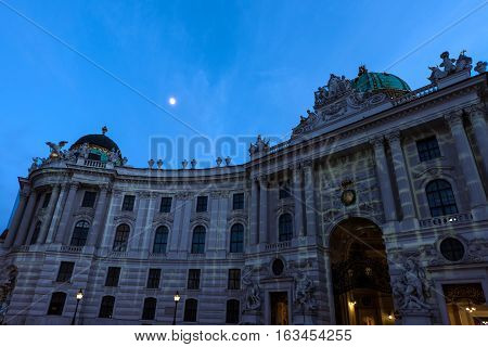 Famous hofburg palace in vienna in the evening, seen from michaelerplatz, austria