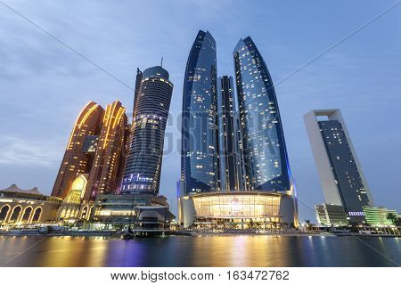 The Etihad Towers in Abu Dhabi illuminated at night. United Arab Emirates Middle East