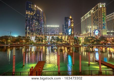 Macau, China - December 8, 2016: City of Dreams reflected in the Canal of The Venetian Casino at night. Luxury resort casino in the famous Cotai Strip in Macau.