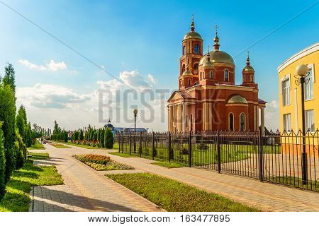 STROITEL BELGOROD REGION RUSSIA - JULE 02 2016: District center in the Belgorod region. Alley overlooking on the current Orthodox church in honor of the New Martyrs and Confessors of Belgorod.