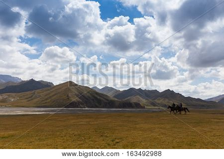BAYAN-ULGII, MONGOLIA - APREL 10: Unidentified young boy ride a horse around of village Sagsai of Western Mongolia on Aprel 10, 2016 in Bayan-Ulgii, Mongolia.