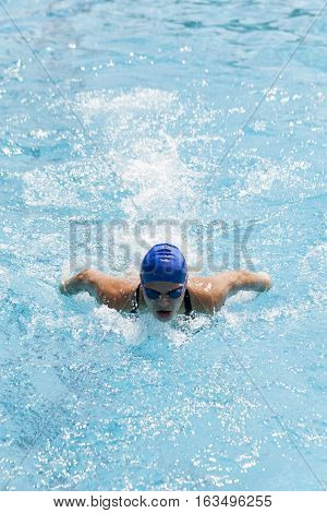 A young woman swimming in the pool Selecitve focus and small depth of field