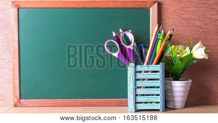 Green school chalkboard with written sentence space