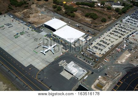 HONOLULU - APRIL 20: Aerial view of planes helicopters and hangers at the Honolulu International Airport HNL on Oahu Hawaii. April 20 2016.