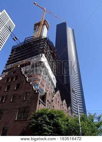 The Rainier Club building under construction and Columbia Center in Seattle Washington on a nice day June 2016.