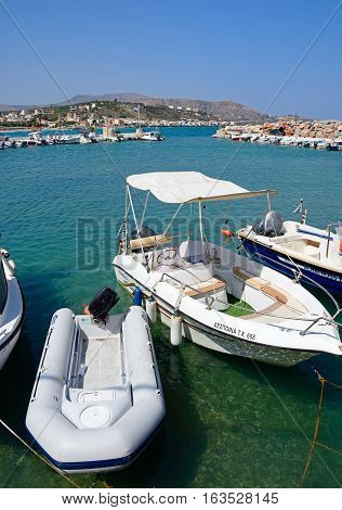 KALYVES, CRETE - SEPTEMBER 16, 2016 - Small boats moored in the harbour Kalyves Crete Greece Europe, September 16, 2016.