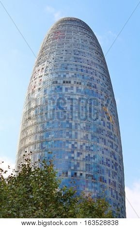 BARCELONA, SPAIN - OCTOBER 08, 2013: Torre Agbar in Technological District in Barcelona, Spain. This 38-storey tower was designed by the famous architect Jean Nouvel