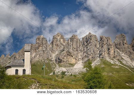 Little Church at the Gardena Pass with mountains of Cir Group in the background Dolomites