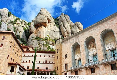 View of Montserrat Monastery. Beautiful Benedictine Abbey high in mountains. Catalonia. Spain