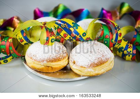Donut for carnival New Year's Eve colorful hats streamers