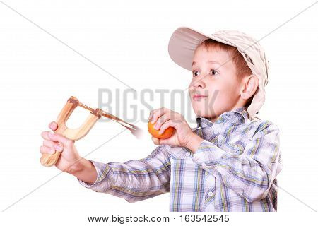 Young Boy Use Sling Shot Shoot Mandarine.