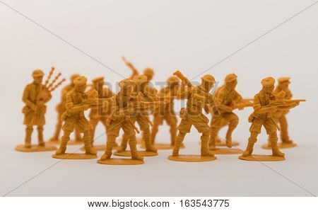 Brown plastic toy soldiers with white background