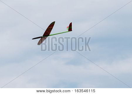RC remotely controlled soaring plane model sailplane on blue sky in brisk wind