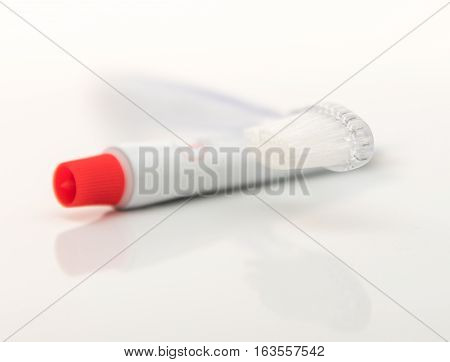 Transparent tooth brush with tooth paste isolated on white background