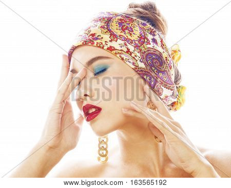 young pretty modern girl with bright shawl on head emotional posing isolated on white background, asian people ethnicity
