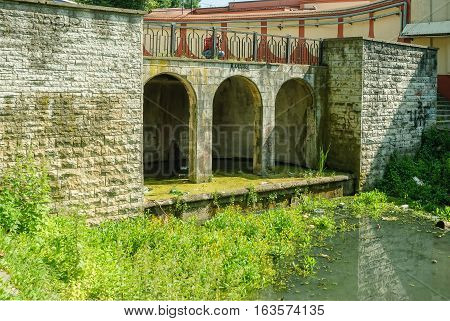 Cascade of water falls and Nizhny pond. Kaliningrad. Russia