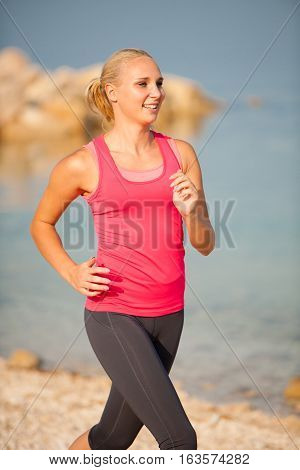 Jogging In Th Beach - Woman Runns Near Sea On Early Summer Morning