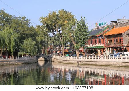 BEIJING CHINA - OCTOBER 26, 2016: Unidentified people visit Houhai lake Futong street.