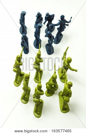 Small plastic toy soldiers on white background