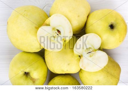 Ripe Antonovka apples on white wooden table. Top view.