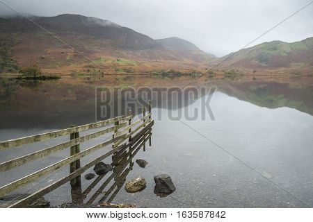 Beautiful Autumn Fall Landscape Image Of Crummock Water At Sunrise In Lake District England