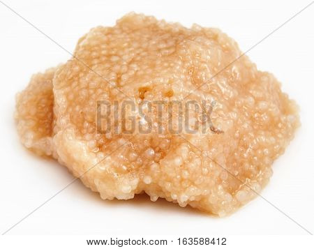 Handful Of Salty Caviar Of Herring On White Plate