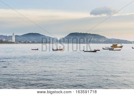 Patong beach on twilight cloudy Phuket Thailand. It is well-known destination for tourists all over the world.