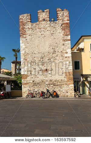 BARDOLINO ITALY - MAY 4 2016: Bardolino attractive old town on the Veronese shore of Lake Garda. Its downtown is lined with shops bars restaurants and pizzerias.