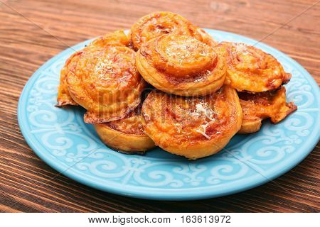 Puff pastry rolls with ham and cheese. Food for parties. Snack.