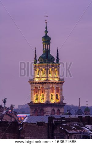 Evening Lviv. View of the central part of the city and church: Evening lighting Korniakt Tower.