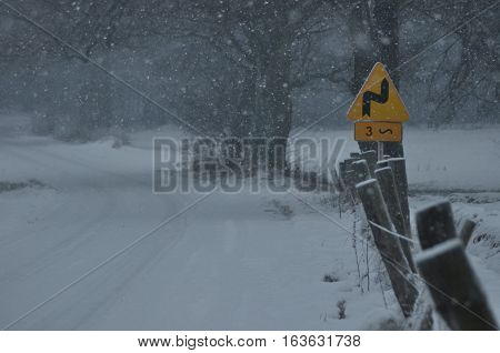 Road signs the sign of the bend. Winding road. Slip by