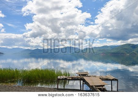 Wooden platform lays wasted on bank of Lugu lake, at Daluoshui village, Lijiang, China