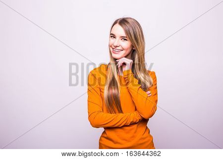 Happy Blonde Girl In Orange T-shirt On White