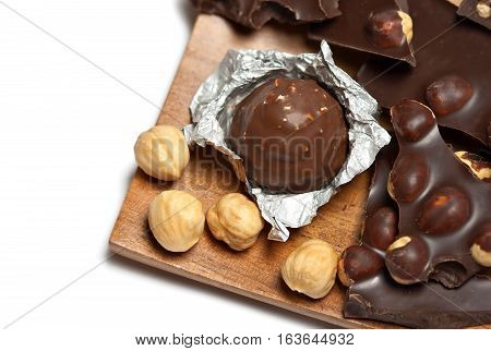 Chocolate bar and candy with hazlenut isolated on white background