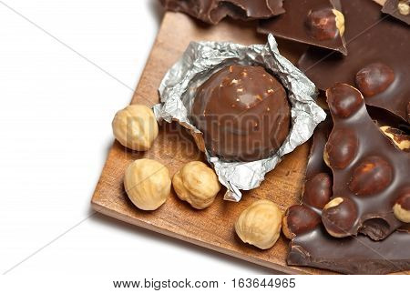 Chocolate bar and candy with hazlenut isolated on white background