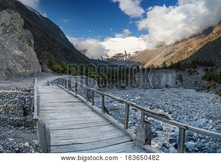 Bridge for walkway in mountain valey. Beautiful natural landscape