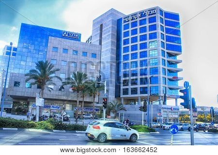 HERZLIYA, ISRAEL - AUGUST 31, 2015: Streets and modern building in Herzliya, Israel. Herzliya Pituach is a sought-after venue for high-tech companies and one of Israel's most affluent neighborhoods.