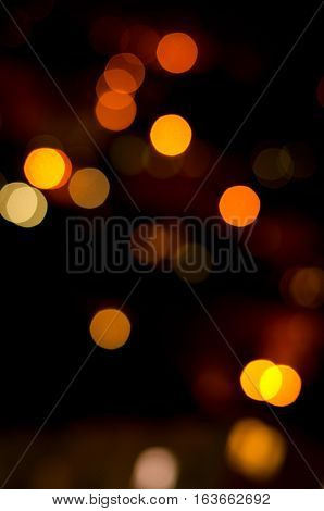 Christmas background. Festive abstract holidaysbackground with bokeh defocused lights and stars, vertical