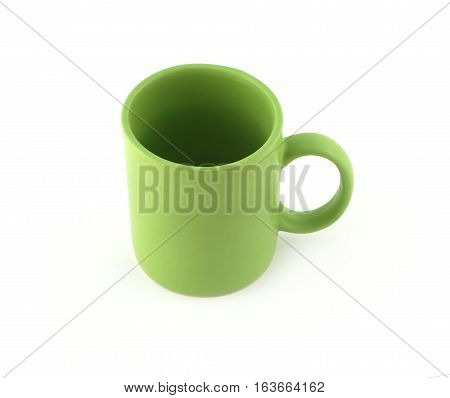 Big empty green tea or coffee cup isolated on white top view closeup