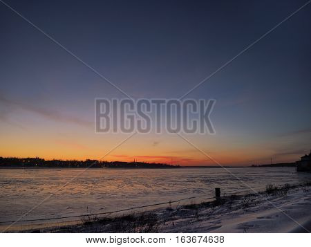 Buitiful sunset at Kostroma on Volga icy shore