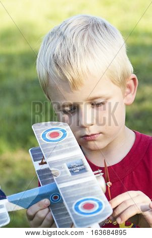 Child young boy and his RC plane toy