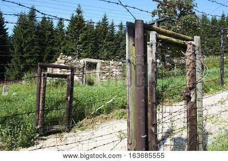 Remains of iron curtain on Czech-German border, an unique original rest of the iron curtain electric fence. Inscription on the sign means - beware! forbidden zone, no entry