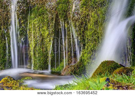 Detail of a small waterfall in the Gjain valley in Iceland