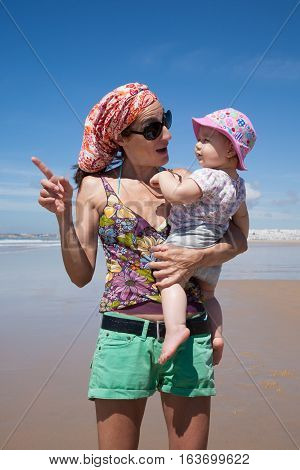 Woman With Baby Pointing