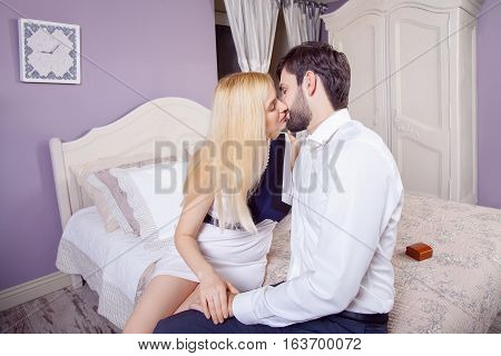Handsome man doing a marriage proposal while offering his wife an engagement ring. Boyfriend make a marriage proposal to his girlfriend in valentine days.