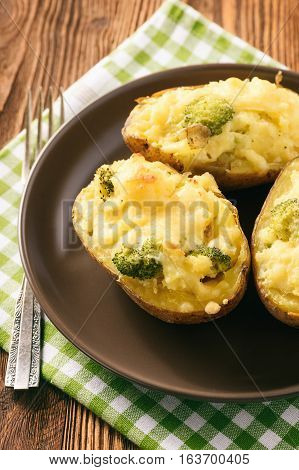 Twice baked potatoes stuffed with broccoli, sour cream and cheese.