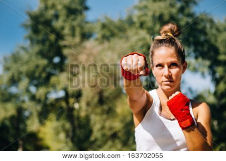 Taebo punch focus on fist, toned image