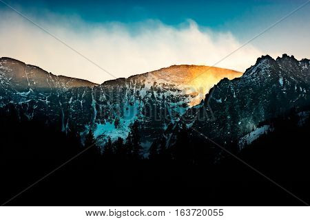 Bright hazy winter sunset near Mount Evans Colorado