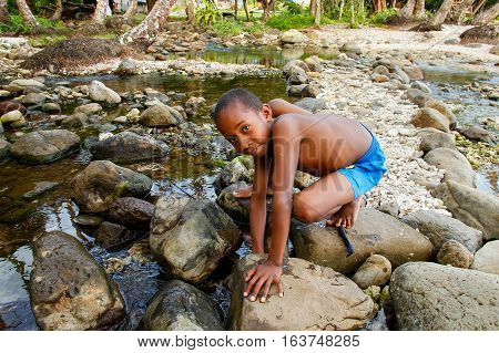 Lavena, Fiji - November 25: Unidentified Boy Plays By The River On November 25, 2013 Along Lavena Co