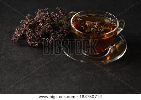 Transpatent Cup Of Herbal Tea With Dried Herbs